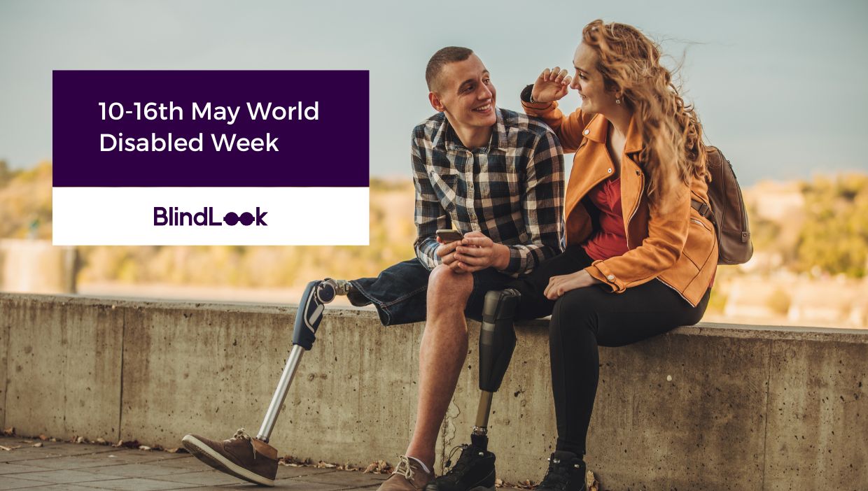 A man and woman with orthopedic disabilities are sitting on the wall