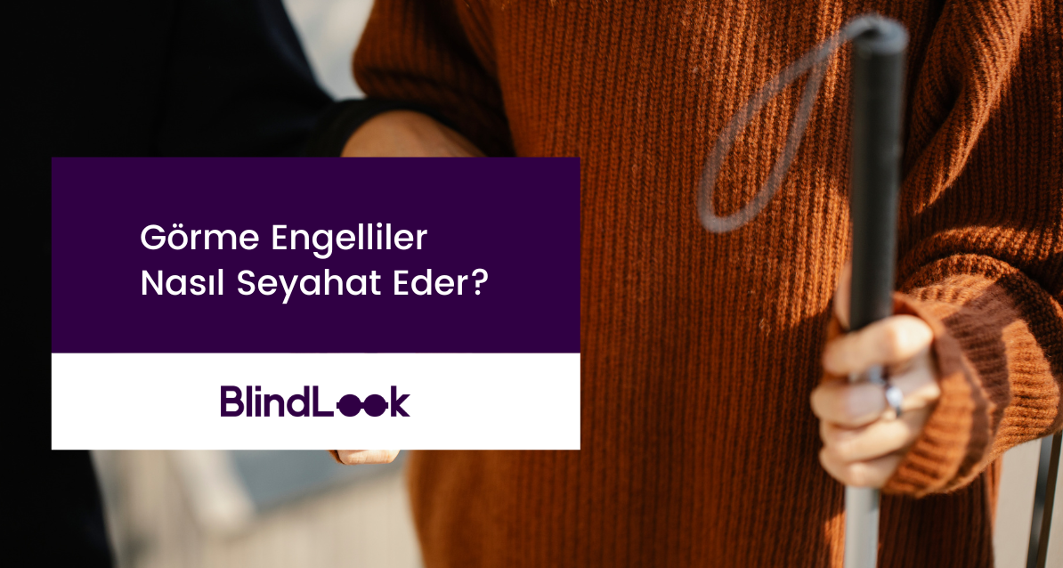 sol eli ile bastonunu tutan üstünde kazak olan bir görme engelli.